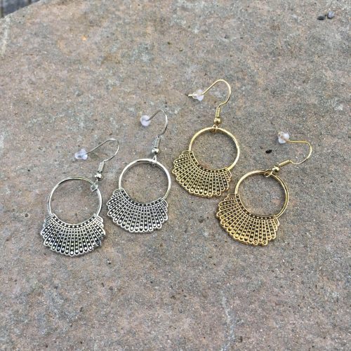 Dissent Collar Hook and Hoop Earrings on rock